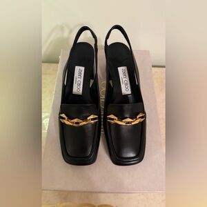 Jimmy Choo
Diamond Tilda Slingback Black and Gold Loafers new